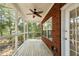 Relaxing screened porch with ceiling fan and wood decking at 8604 Fox Hollow Rd, North Charleston, SC 29420