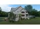 Two-story home with pool and landscaped yard at 945 Fish Camp Rd, Charleston, SC 29492