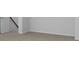 Unfinished basement with carpeted floor and ample space at 107 Pen Shell St, Summerville, SC 29485