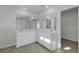 Bathroom boasts double vanity, large mirror, and access to closet at 107 Pen Shell St, Summerville, SC 29485