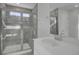 Modern bathroom with a walk-in shower and gray tile at 107 Pen Shell St, Summerville, SC 29485