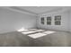 Bright bedroom with neutral walls and carpet, featuring multiple windows at 107 Pen Shell St, Summerville, SC 29485