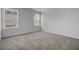 Well-lit bedroom with neutral walls, carpet, and two windows at 107 Pen Shell St, Summerville, SC 29485