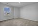 Spacious bedroom with neutral carpeting and large window at 107 Pen Shell St, Summerville, SC 29485