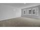 Spacious bedroom with wall-to-wall carpet and multiple windows at 107 Pen Shell St, Summerville, SC 29485