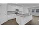 Modern kitchen with white cabinets, granite countertops, and stainless steel appliances at 107 Pen Shell St, Summerville, SC 29485
