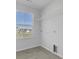 Bright laundry room with window, shelving, and tile floor at 107 Pen Shell St, Summerville, SC 29485