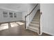 Modern staircase with wooden handrail and carpeted steps at 107 Pen Shell St, Summerville, SC 29485