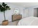 Bright bedroom with dresser and large bed at 110 Threaded Fern St, Summerville, SC 29485