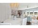 Open concept dining room with chandelier, adjacent to kitchen and living room at 110 Threaded Fern St, Summerville, SC 29485