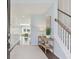 Light-filled entryway, showcasing wood floors and a view to the living area at 110 Threaded Fern St, Summerville, SC 29485