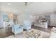 Open living room features light blue walls, and view to kitchen and dining area at 110 Threaded Fern St, Summerville, SC 29485