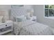 Small bedroom with a gray and white comforter and two nightstands at 114 Threaded Fern St, Summerville, SC 29485