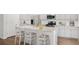 Modern kitchen with white cabinets, granite countertops, and stainless steel appliances at 114 Threaded Fern St, Summerville, SC 29485