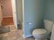 A bathroom features a toilet and bathtub/shower adjacent to an entryway with light blue walls at 1300 Park West Blvd # 1001, Mount Pleasant, SC 29466
