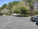 A community boat storage area featuring several boats parked neatly in designated parking spaces at 1300 Park West Blvd # 1001, Mount Pleasant, SC 29466