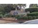 Community entrance sign with landscaping and brick wall at 1300 Park West Blvd # 1001, Mount Pleasant, SC 29466