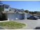 A row of well-maintained garages featuring individual entrances, offering convenient parking and storage at 1300 Park West Blvd # 1001, Mount Pleasant, SC 29466