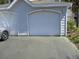 Attached garage featuring a well-maintained door, offering secure parking and additional storage space at 1300 Park West Blvd # 1001, Mount Pleasant, SC 29466