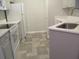 A well lit kitchen is furnished with an oven, refrigerator, and sink with updated countertops at 1300 Park West Blvd # 1001, Mount Pleasant, SC 29466