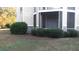 Ground floor patio with a screened enclosure and landscaping at 1300 Park West Blvd # 1001, Mount Pleasant, SC 29466