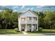 Two-story craftsman home with light green siding, front porch, and landscaping at 140 Maritime Way, Summerville, SC 29485