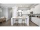 Modern kitchen with white cabinets, island, and stainless steel appliances at 140 Maritime Way, Summerville, SC 29485