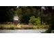 Serene waterfront view with birdhouse and lush trees at 140 Maritime Way, Summerville, SC 29485