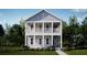 Two-story light-blue house with white columns and balcony, surrounded by lush greenery at 142 Maritime Way, Summerville, SC 29485