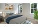 Spacious bedroom with large windows and plush bedding at 1443 Clay Field Trl, Summerville, SC 29485