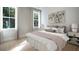 Bright bedroom with a king-size bed and plenty of natural light at 1443 Clay Field Trl, Summerville, SC 29485