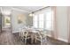 Bright dining room with hardwood floors and large windows at 1443 Clay Field Trl, Summerville, SC 29485