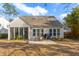 Spacious backyard with patio, screened porch and mature trees at 1589 Pixley St, Charleston, SC 29414