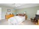 Charming bedroom with light green walls and a comfortable bed at 1589 Pixley St, Charleston, SC 29414