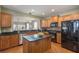 Modern kitchen with wooden cabinets, granite countertops, and stainless steel appliances at 1589 Pixley St, Charleston, SC 29414