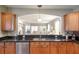 Kitchen with dark granite countertops, wooden cabinets, and an island at 1589 Pixley St, Charleston, SC 29414