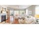 Spacious living room with a sectional sofa, hardwood floors, and a fireplace at 1589 Pixley St, Charleston, SC 29414