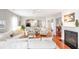 Living area with hardwood floors, white sectional sofa, and fireplace at 1589 Pixley St, Charleston, SC 29414