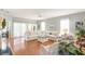 Living room with hardwood floors, white sectional sofa and fireplace at 1589 Pixley St, Charleston, SC 29414