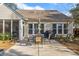 Relaxing patio with seating area, umbrella, and grill at 1589 Pixley St, Charleston, SC 29414