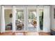 Sunroom with double sliding glass doors and rocking chairs at 1589 Pixley St, Charleston, SC 29414
