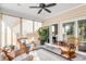 Bright sunroom featuring comfortable seating and access to backyard at 1589 Pixley St, Charleston, SC 29414