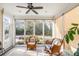 Relaxing sunroom with wicker furniture and ample natural light at 1589 Pixley St, Charleston, SC 29414