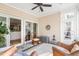 Spacious sunroom with multiple seating options and sliding doors at 1589 Pixley St, Charleston, SC 29414