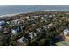 Aerial view of coastal neighborhood, showcasing houses near the ocean at 1738 Ion Ave, Sullivans Island, SC 29482