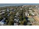Aerial view of coastal neighborhood with marsh and tennis courts at 1738 Ion Ave, Sullivans Island, SC 29482