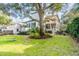 Large backyard with mature tree and patio seating at 1738 Ion Ave, Sullivans Island, SC 29482