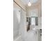 Classic bathroom with white tile, pedestal sink, and bathtub at 1738 Ion Ave, Sullivans Island, SC 29482