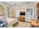 Spacious bedroom with a large bed, dresser, and a chandelier at 1738 Ion Ave, Sullivans Island, SC 29482