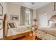 Cozy bedroom with two twin beds and hardwood floors at 1738 Ion Ave, Sullivans Island, SC 29482
